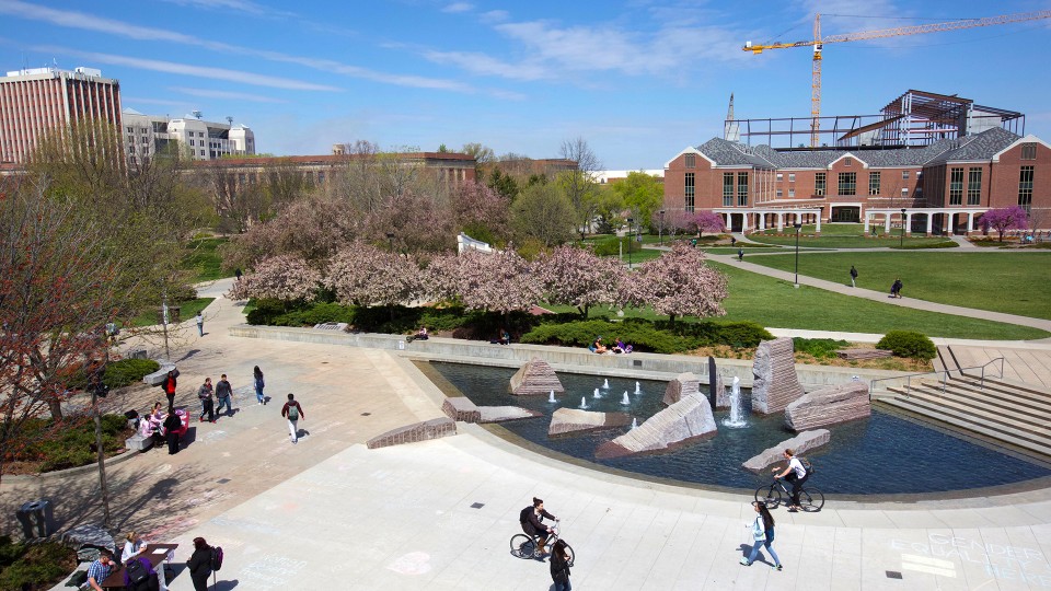 Students walk by UNL's Broyhill Fountain, which is part of the plaza on the north side of the Nebraska Union. The current version of the fountain has been in operation since 1999.