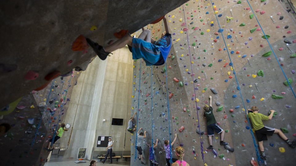 Bright Lights campers play Ninja Tag during their UNL climbing wall visit on June 7. The climbing structure is part of UNL's Outdoor Adventures Center.