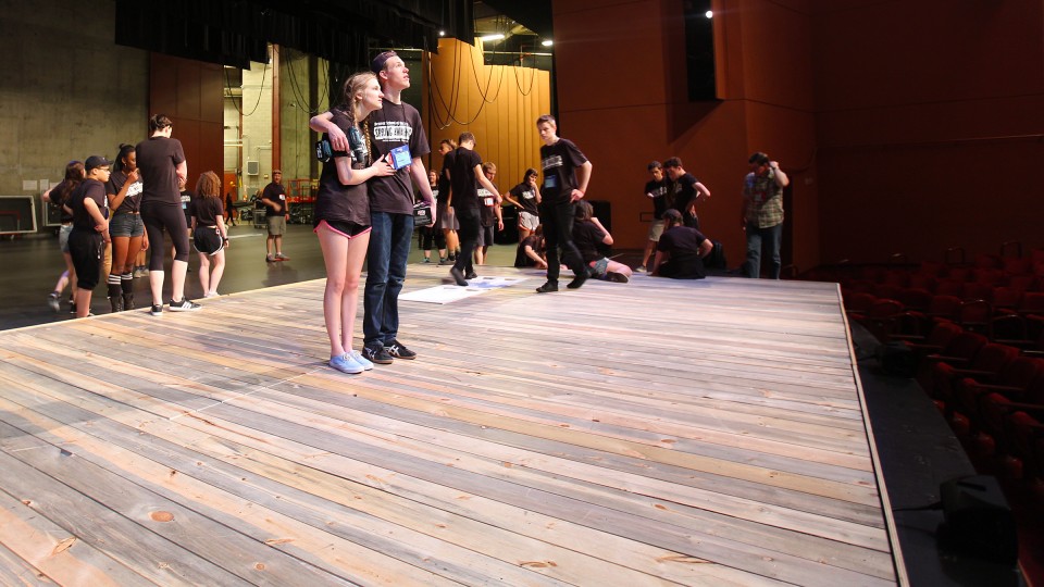 Denver School of the Arts students Serena Trainor (left) and Alastair Hennessy examine the Lied Center audience seating area as the set for "Spring Awakening" is moved into place. The production was the International Thespian Festival's featured show at the Lied on June 23.