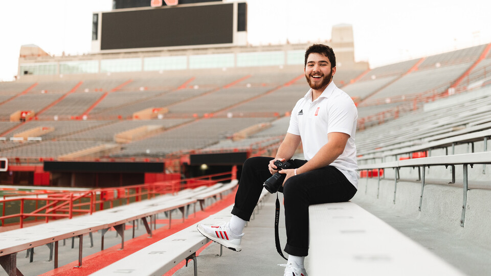 Ethan Weldon is photographed in Memorial Stadium, where he's worked as part of the social media department for NU Athletics.