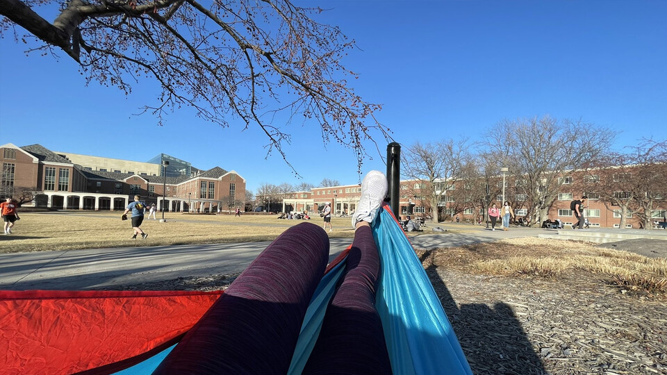 Charlotte Gottfried, an advertising and public relations major, enjoyed a relaxing swing in the hammocks north of the Nebraska Union on Feb. 28. Learn more at https://go.unl.edu/5b8h.