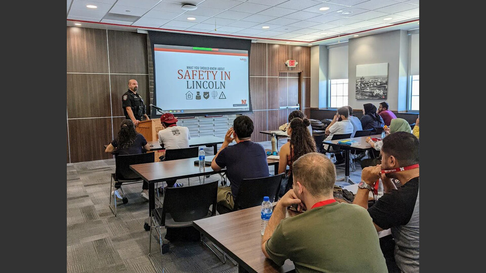 International Fulbright scholars listen to a security presentation from Captain Aaron Pembleton of the University Police Department on July 13. The fellows are on campus for four weeks this sum-mer preparing to begin their academic degree programs at institutions across the nation. The pro-gram is hosted by the university’s English as a Second Language program. Learn more at https://go.unl.edu/0u9h.