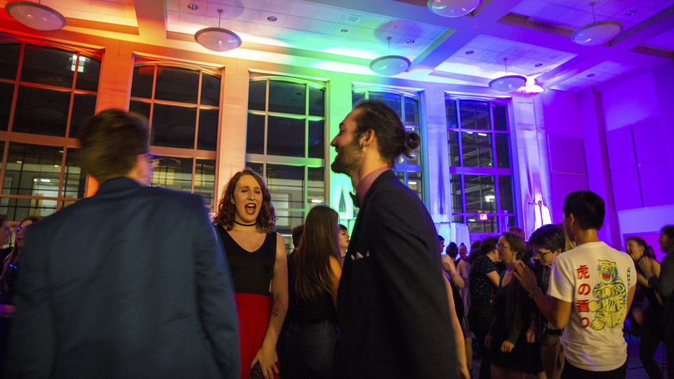 Jake Piccini (center) dances with friends during the Rainbow Ball on Oct. 4 in the Great Hall of the Kauffman Residential Center. The LGBTQA-friendly event is a new homecoming tradition at the University of Nebraska–Lincoln.