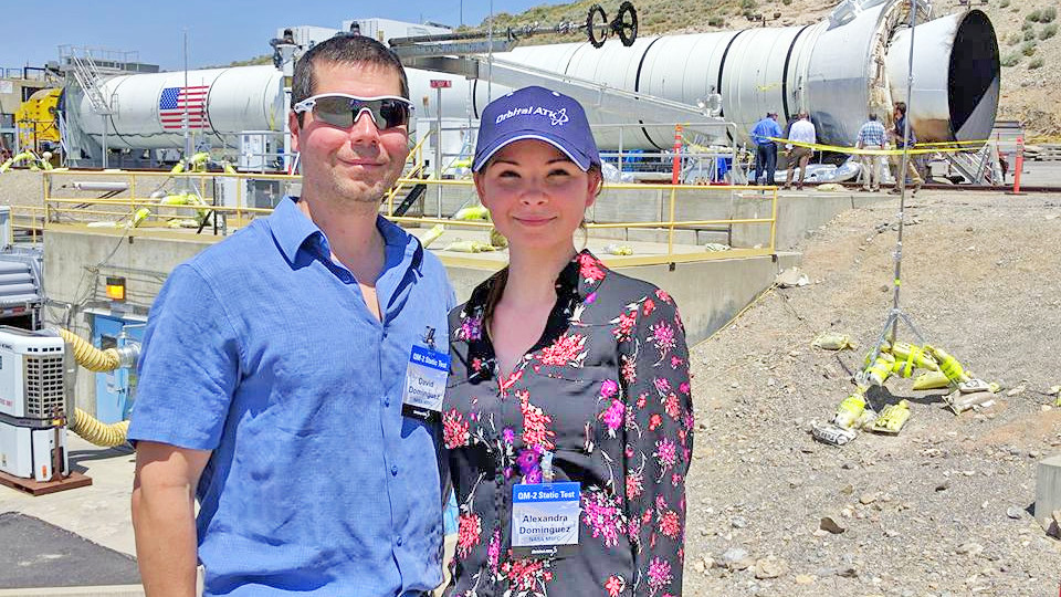 Alexandra Dominguez and her husband, Dave, stand in front of a booster rocket at the Orbital ATK test facility in Promontory, Utah. The Dominguezes attended a ground test of the Space Launch System’s five-segment solid rocket motor on June 28, 2016.