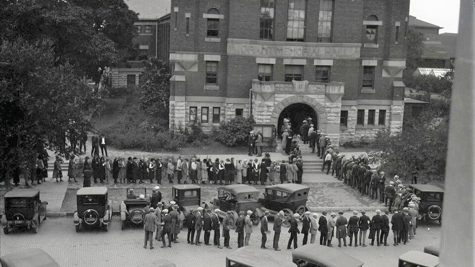 First-year students stream out of Grant Memorial Hall and onto 12th Street as they wait to register for classes in 1923.