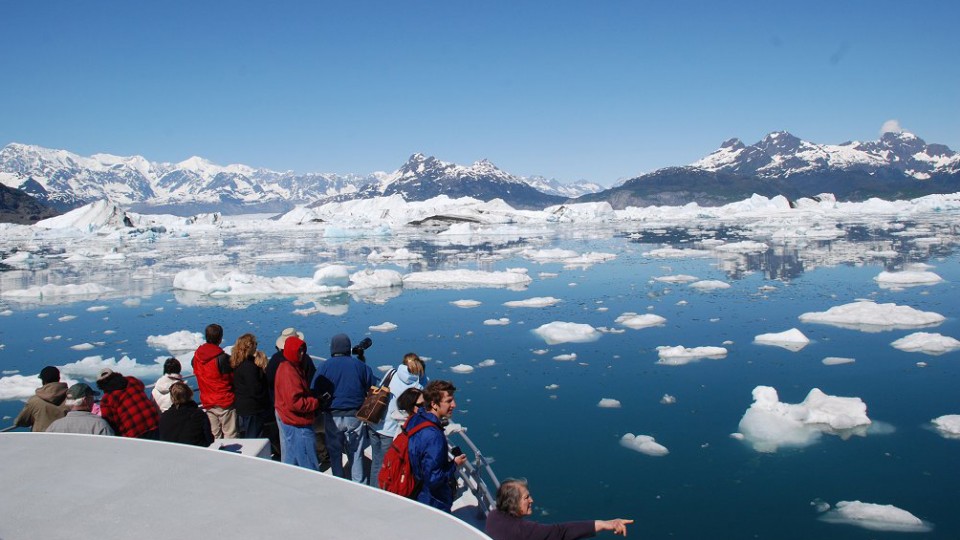 Photographers crowd the front of a boat during a tour of Prince William Sound and the Columbia Glacier in Alaska. A new report issued by UNL outlines how rapid warming in the Arctic is influencing weather effects in the central United States.
