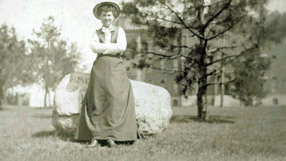Willa Cather posing near a rock while on campus in an undated photo.
