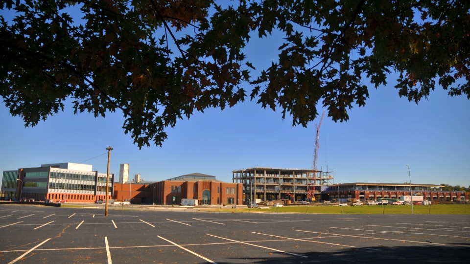 Construction at Nebraska Innovation Campus continues with work on the Food Innovation Center (right). Completed buildings include Innovation Commons (left), which includes the former Nebraska State Fair 4-H Building. The Food Innovation Center includes the former Industrial Arts Building.