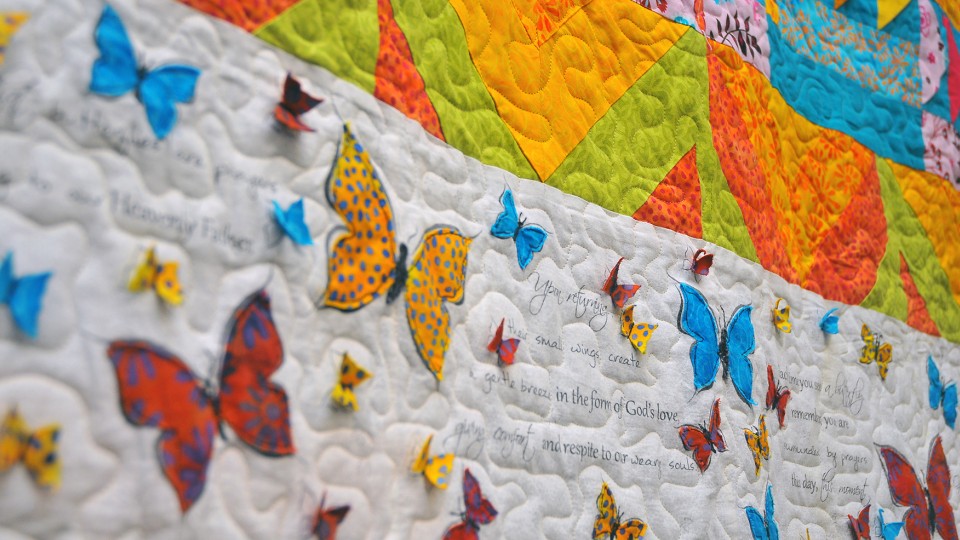 Detail of the comfort quilt made by members of the Quilt-N group for Mary Ourecky.