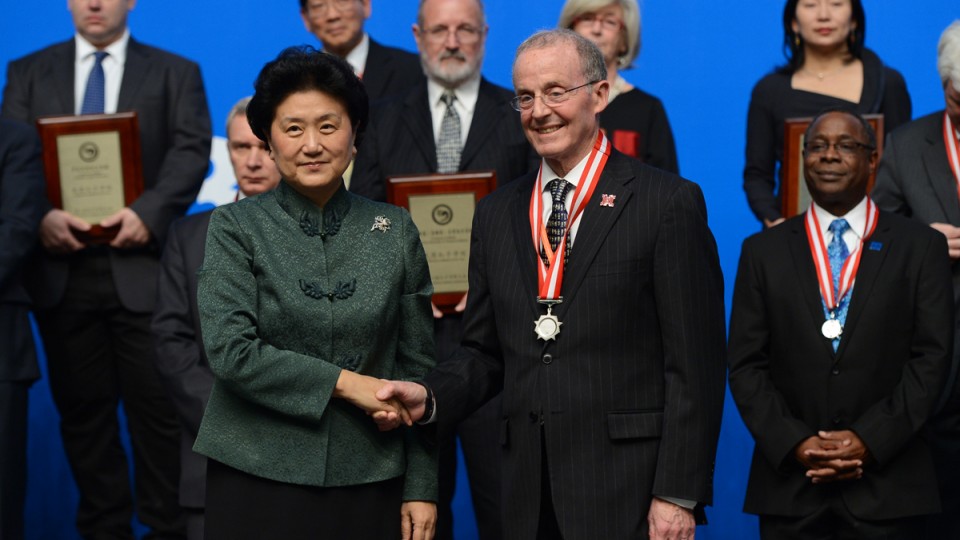 Chancellor Harvey Perlman shakes hands with Liu Yandong, vice premier of state council of the People's Republic of China, during the Confucius Institute Conference award ceremony.
