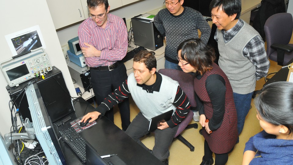 Faculty from Xi’an Jiaotong University tour the lab of Shadi Othman in Chase Hall on Dec. 5. Pictured (clockwise from top left) are Othman, Zhongji Han (UNL), Zhimao Yang (XJTU), Yong Mei Chen (XJTU) and Vahid Khalilzad Sharghi. Other members of the XJTU group not pictured are Lijuan Wang, Xili He and Yaping Fan.