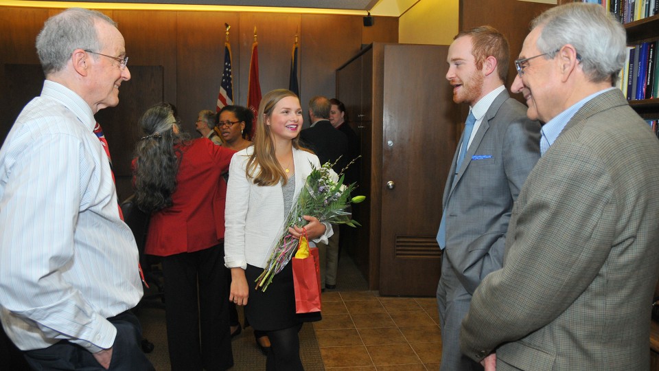Annie Himes (second from left) talks with (from left) Chancellor Harvey Perlman, Matthew Boring and Patrice Berger, director of the University Honors Program, during a Truman Scholar celebration in Canfield Administration Building on April 9. Himes is one of 60 students nationally to earn the award this year. Boring, marketing and sales manager at the Lied Center for Performing Arts, was named a Truman Scholar in 2010.