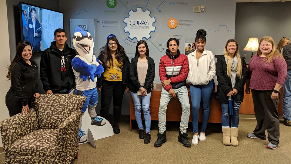 Nebraska's Selma De Anda Gallegos (left) poses with Lincoln students during a tour of Creighton University. De Anda Gallegos is a part of TRIO's Educational Talent Search program.