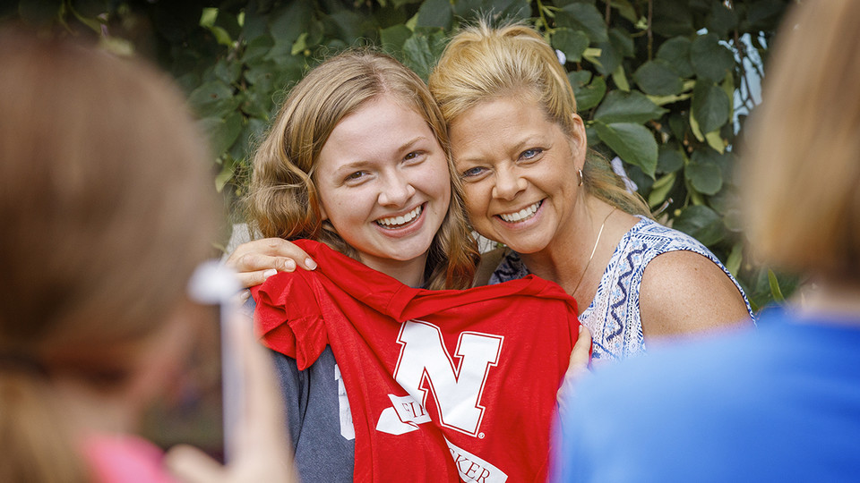 A freshman student displays her First Husker shirt during a back-to-school event in August. The event celebrated students who are the first in their family to go to college.