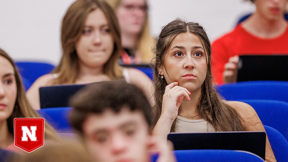 Students sitting and listening in a lecture hall
