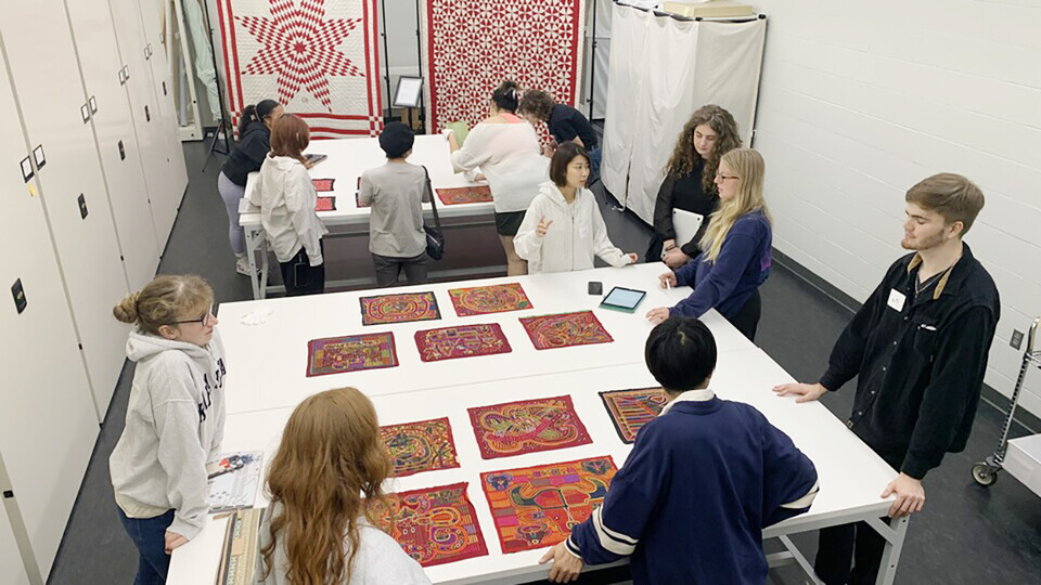 Students from UNL and Saitama University work together on the exhibition.