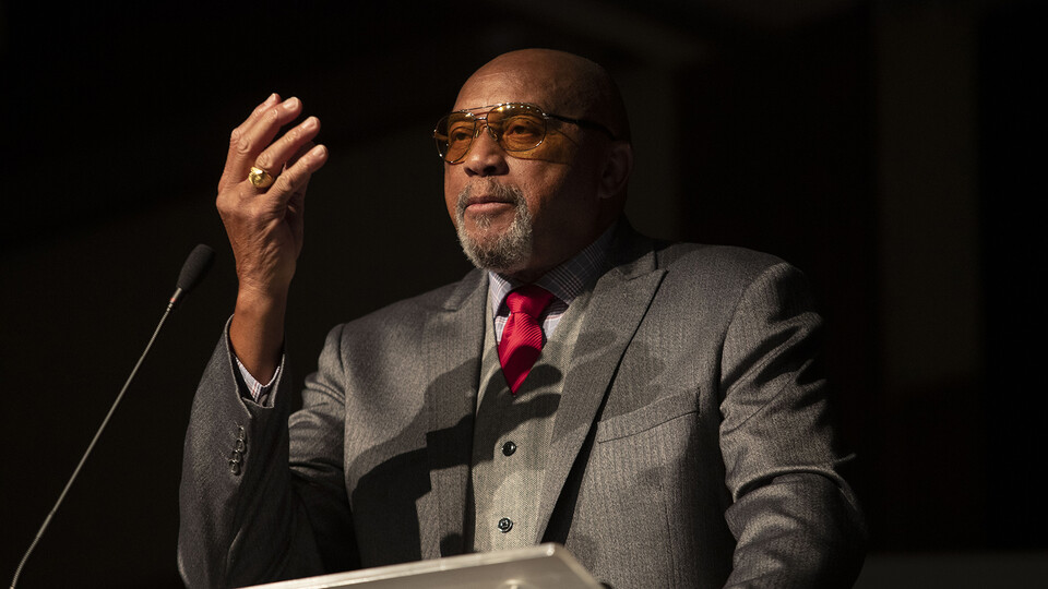 Tommie Smith, a gold medal-winning Olympian and civil rights icon, gestures during his 2023 MLK Week keynote address on Jan. 25.
