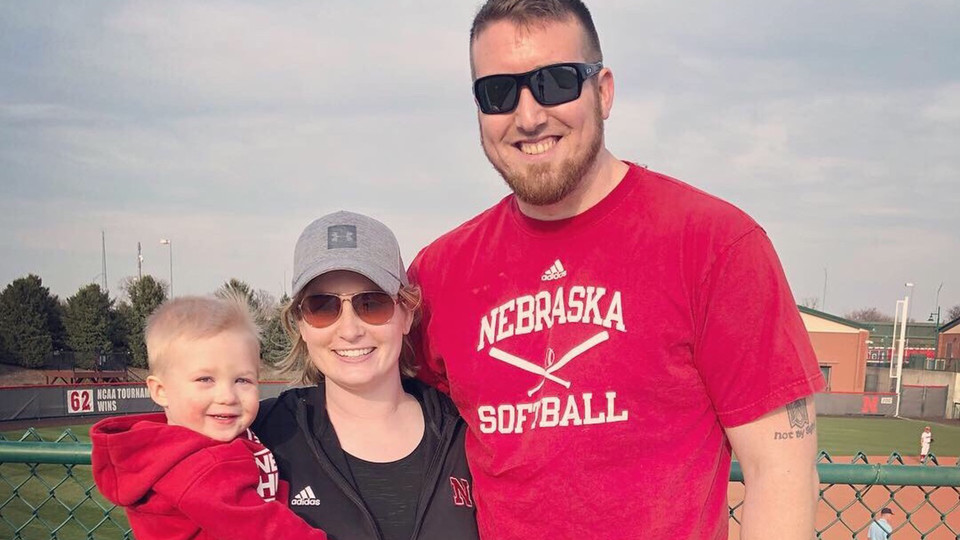 The Moudy family (from left) Ace, Megan and Mike, pose for a photo at Bowlin Stadium. The son of the two former Huskers, Ace died unexpectedly in April.