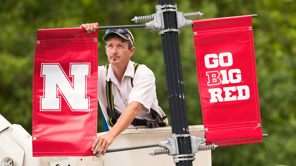The new Nebraska N is placed on a lamp post along R Street. Starting July 1, the Nebraska N is replacing icons used by academic units, Nebraska Athletics and the Nebraska Alumni Association. 