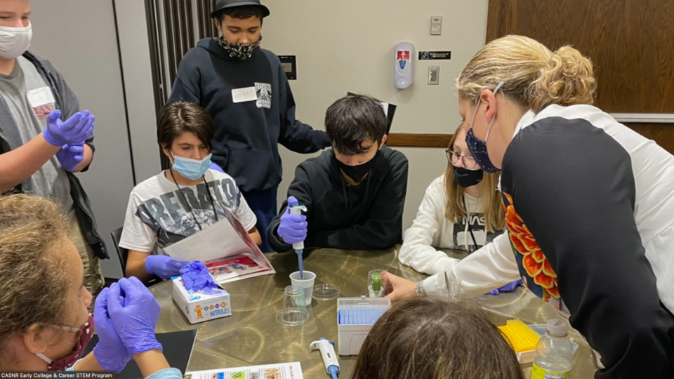 Lincoln Northeast students conduct an experiment as part of the university's Early College and Career STEM program.