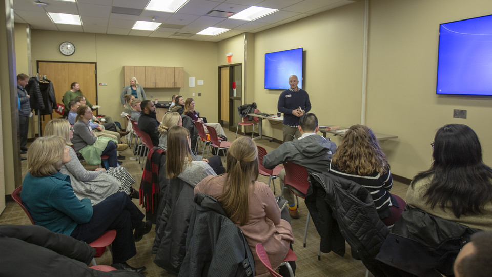 Faculty and staff listen to a presentation about recreation options available in Lincoln during the Campus Community Connection program in February. The new program is designed to help faculty and staff make connections with colleagues on campus and community programs.