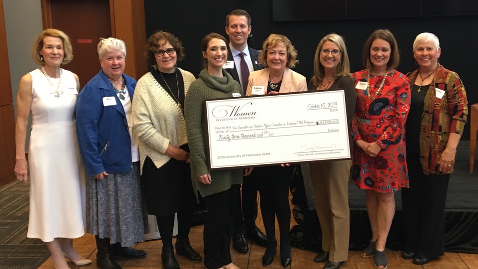 Nebraska's Counselor-in-Residence Program received a $93,000 grant from Women Investing in Nebraska on Oct. 16. Pictured at the event (from left) is Candy Henning, Ann Bruntz, Connie Boehm, Vanessa Neuhaus, Jake Johnson, Laurie Bellows, Tricia Besett-Alesch, Susan Rosenlof and Linda Hoegemeyer.