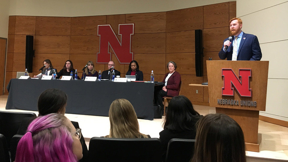 Tyler White, assistant professor of political science and interim director of the National Security Studies program, introduces the panel of intelligence officials who spoke to students at the Women in National Security Symposium Feb. 22.