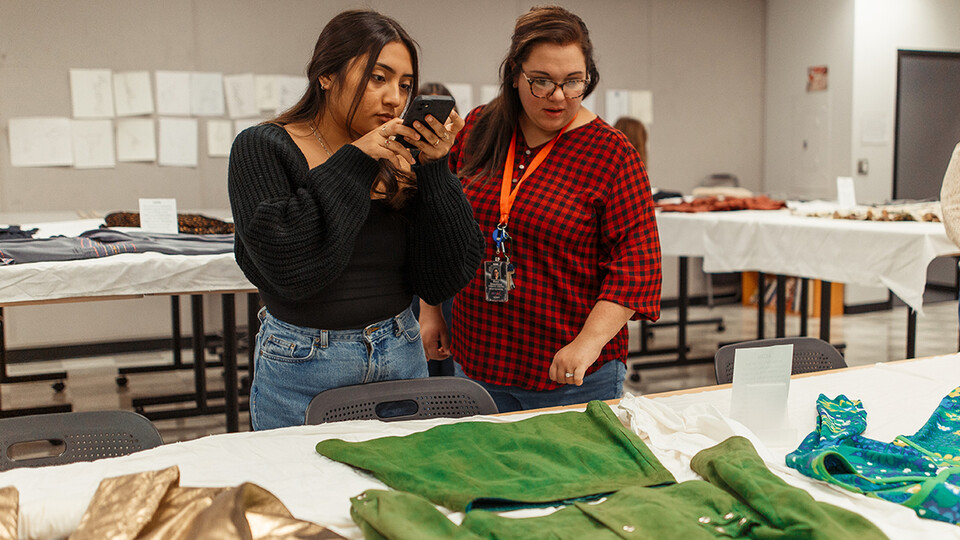 South High student Brianna Solis-Romero, left, and teacher Mary Breedlove during their visit to Nebraska's Department of Textiles, Merchandising and Fashion Design.