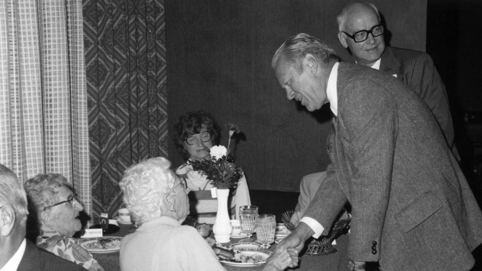 Pres. Gerald Ford (front, right) and former NU president D.B. Woody Varner (right) greet guests during a luncheon in September 1977.