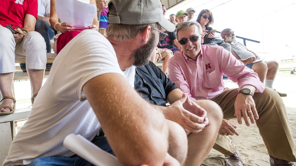 .Spectators at the Fillmore County Fair talk with Chancellor Ronnie Green during his June 13 trip to three counties in southeastern Nebraska.