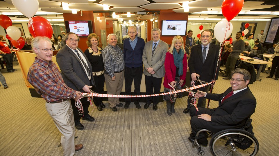 The Department of Chemistry celebrated the remodeling of Hamilton Hall's second floor chemistry laboratories and new resource center with a ribbon cutting. From left: Mark Griep, Dr. Jim Takacs, Peg Bergmeyer, Darrel Kinnan, Jim Carr, Jason Kautz, Alecia Kimbrough, Dan Hoyt and Lance Perez. 