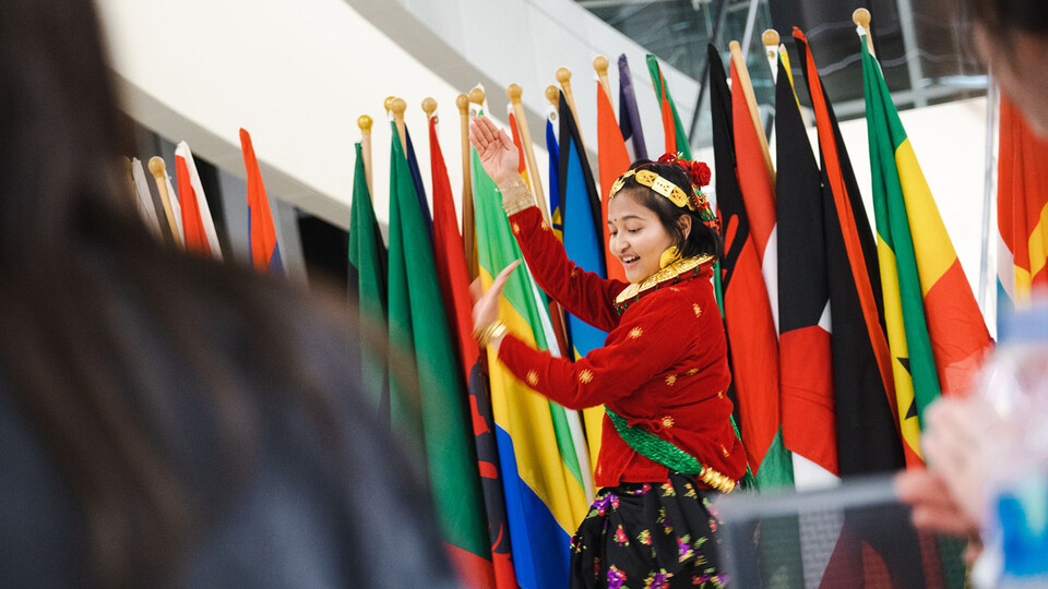 Sandhya Karki, a junior from Nepal, performs a traditional dance from her country during Global Café and Connections, a signature International Education Week event.