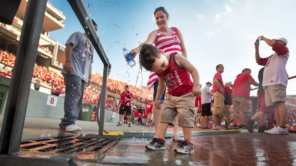 A young fan cools off during Nebraska's season opener Aug. 31 at Memorial Stadium. UNL officials are again urging fans attending this week's game to guard against heat illness.