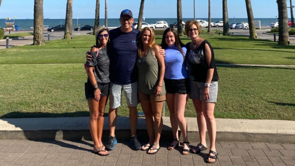 Krista Hoover (right) stands with family during a visit to Galveston Island. The Texas vacation site is a favorite for Hoover.