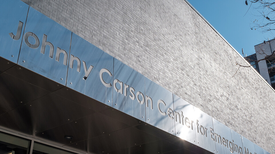 A metal sign reads "Johnny Carson Center for Emerging Media Arts."