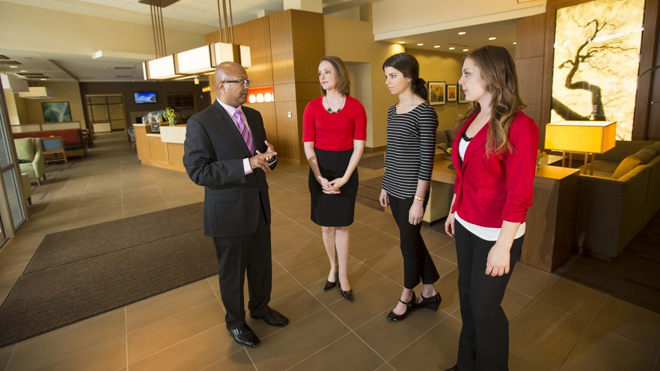 Dipra Jha, assistant professor of practice, in Hospitality, Restaurant and Tourism Management, meets with UNL students at the Hyatt Place in Lincoln's Haymarket.