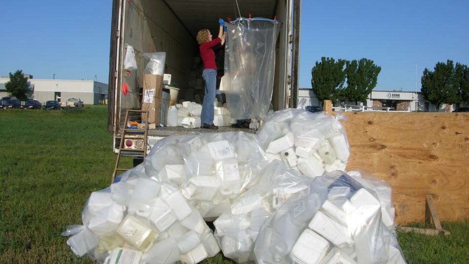 Leah Sandall, a lecturer in agronomy and horticulture, works at a UNL Extension pesticide container recycling site. The program, which has recycled more than 1,000 tons of the containers, is in its 23rd year.