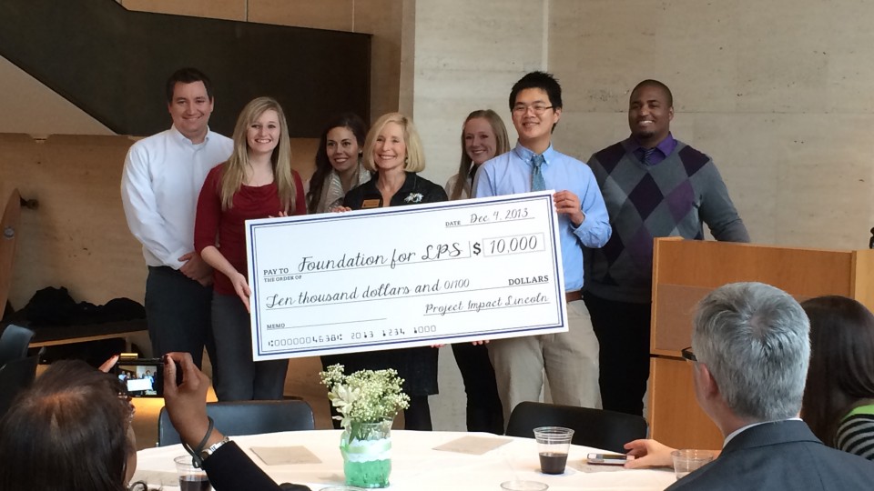 Members of the Leading People and Projects class in the College of Business Administration award a grant of $10,000 to the LPS "Hear to Learn" project.  