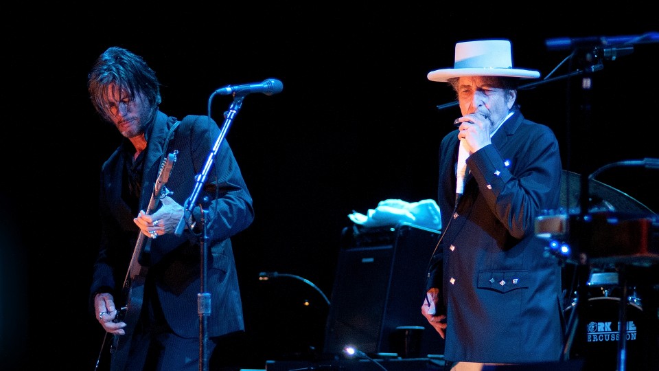 Bob Dylan (right) sings during a 2012 concert in Spain.