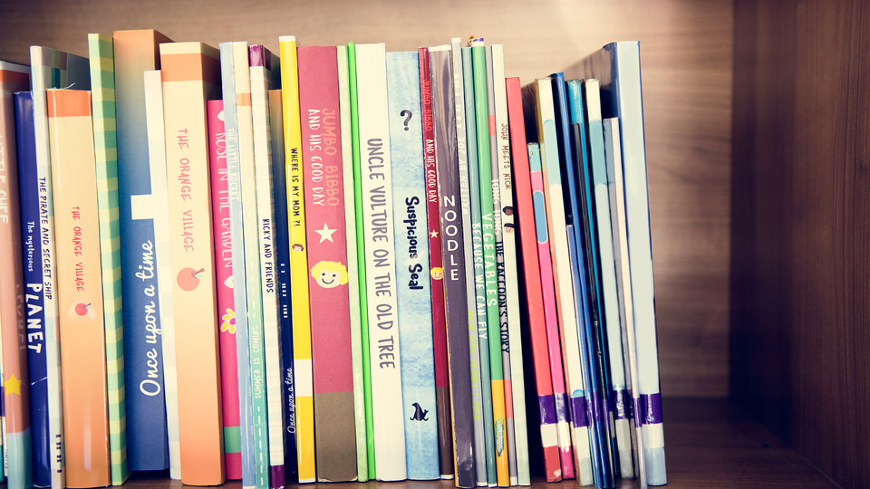 Children's books on a shelf