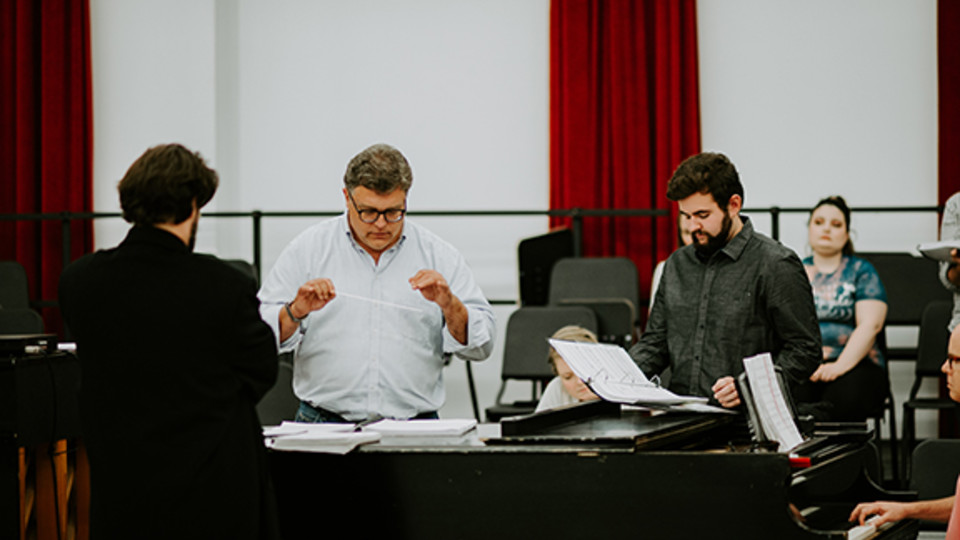 Tyler White (center) rehearses with Patrick McNally (left) and Matthew Gerhold. The Glenn Korff School of Music is premiering a new opera “The Gambler’s Son” by composer Tyler Goodrich White and librettist Laura White. 