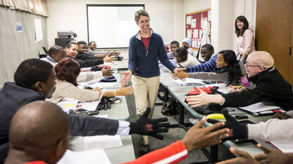 Elizabeth Theiss-Morse greets a group of students from Africa before lecturing on "Why National Identity Matters in American Politics" during the 2014 Study of the United States Institute on Civic Engagement. At right is Patrice McMahon, academic director of the SUSI Institute and associate professor of political science. UNL has received a federal grant to host the program again in 2015.