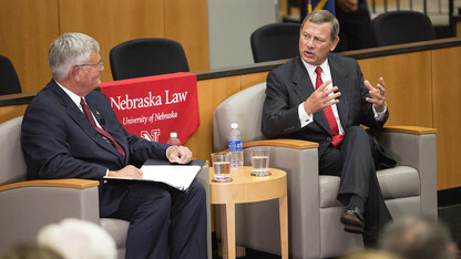 U.S. Chief Justice John Roberts (right) answers a question from William Jay Riley, Chief Judge of the Eighth U.S. Circuit Court of Appeals, during the Sept. 19 discussion at the University of Nebraska's College of Law.