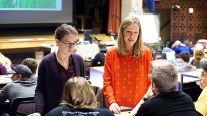 Jenny Dauer, assistant professor of natural resources, speaks with a student about a decision-making exercise. Dauer's forthcoming research is on using the decision-making model to teach scientific literacy.