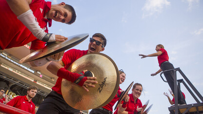 Cornhusker Marching Band cymbal players react during the Boneyard Bash in Memorial Stadium on Aug. 26.