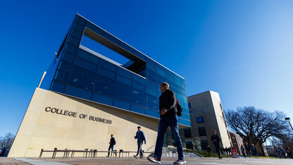 Student walking outside the College of Business 