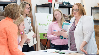 From right, evaluators Michelle Howell Smith, Susan Pense and Leslie Hawley provide feedback to teachers and school personnel participating in the Expanded Learning Opportunity Design Challenge.