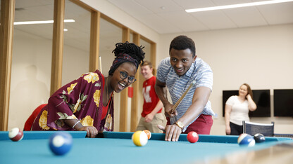 Students play a game of pool in the Massengale Residence Hall. CASNR photo shoot on East Campus. May 29, 2018