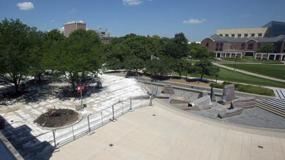 Fencing blocks off a concrete replacement project on the west third of the Nebraska Union Plaza. The work, which continues through mid-August, is the final phase in a three-year upgrade of the plaza.