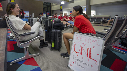 Shridula Hegde (right) talks with Katie Brooks during international student welcome activities on Aug. 19 at the Lincoln Airport. Though it meant a longer flight, Brooks landed in Lincoln to take advantage of Nebraska's enhanced welcome activities for students from abroad.